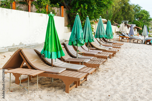 Beach chair and umbrella in early morning