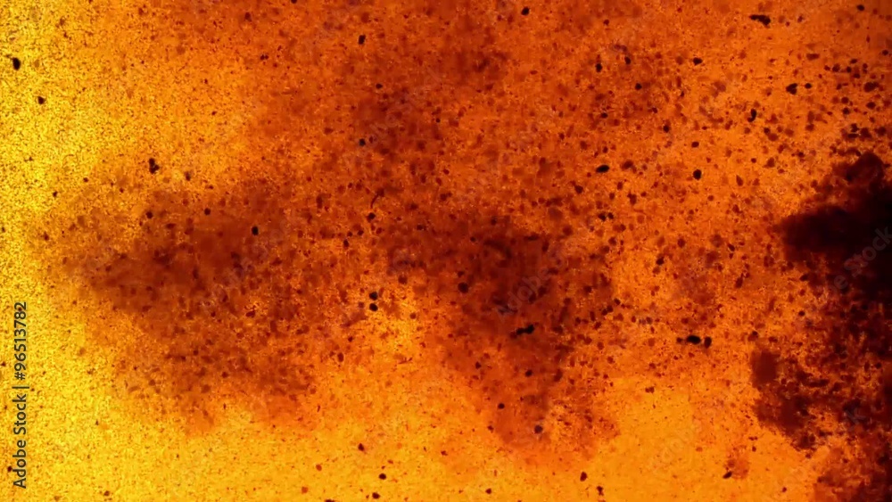Flowing Particles in Orange Liquid Flowing Particles in Orange Liquid