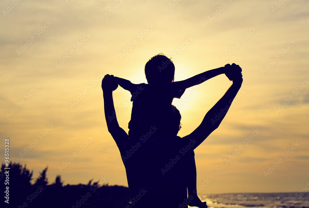 father and son having fun at sunset father and son having fun at sunset