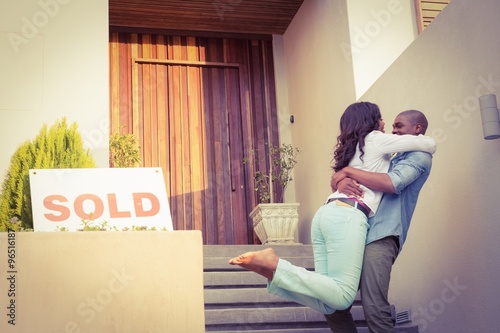 Happy african american couple after buying new house 