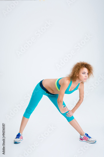Sporty woman doing stretching exercises