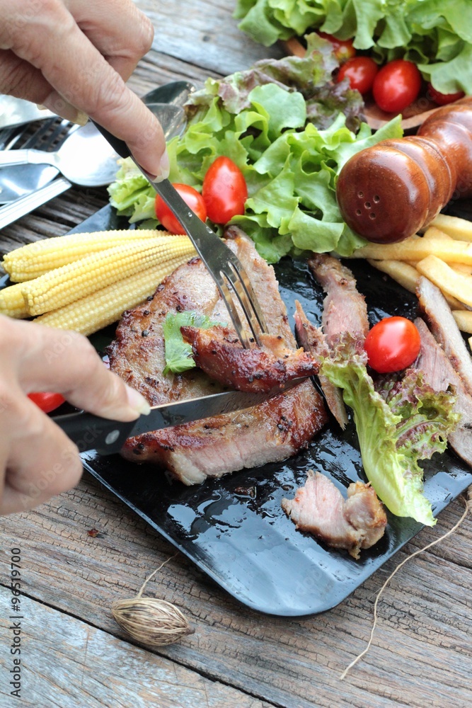 Pork steak of delicious with vegetable and tomato. Pork steak of delicious with vegetable and tomato.