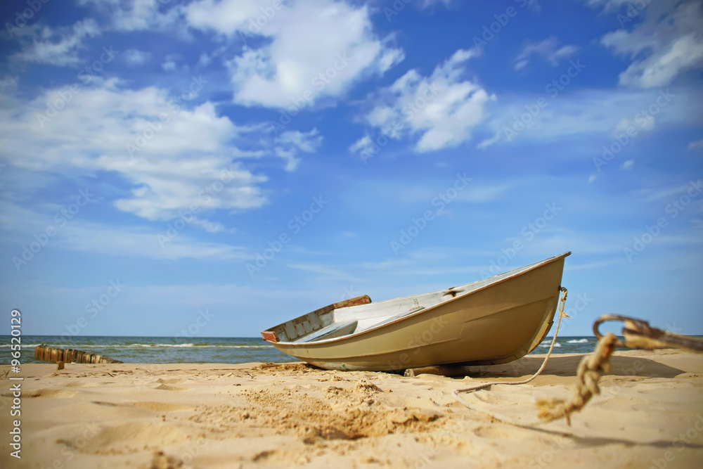 Fishing boat on the beach near seaside