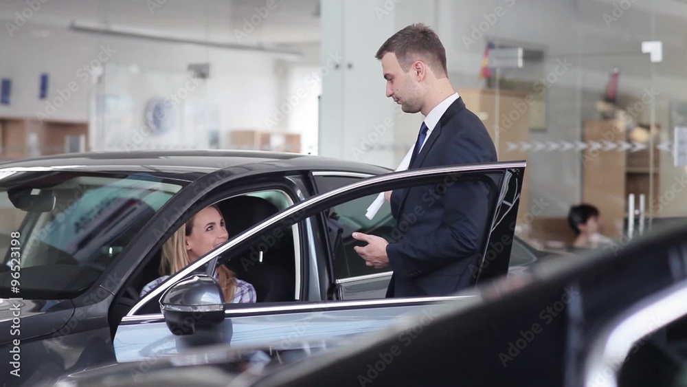 Dealer transmitting the keys of a new car Dealer transmitting the keys of a new car