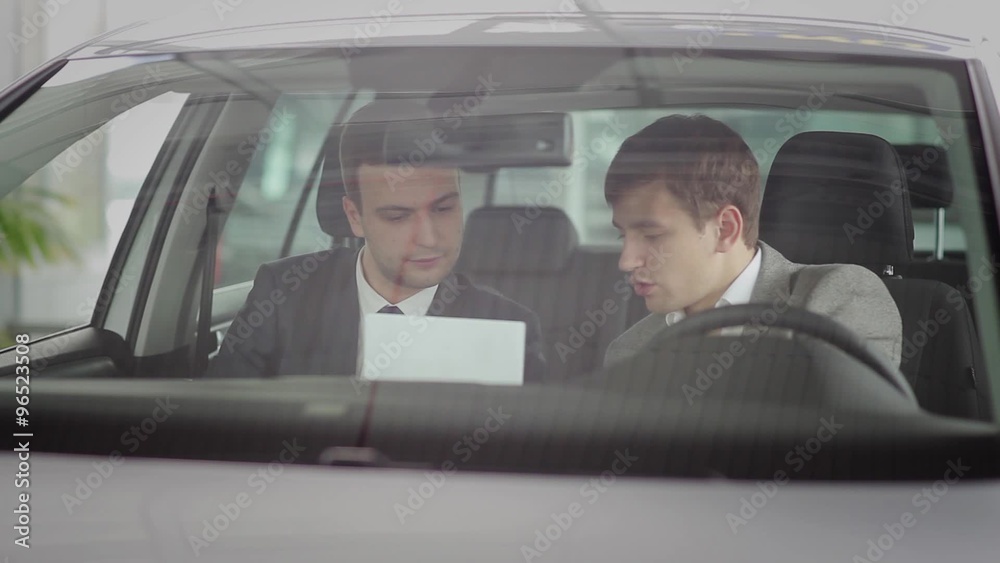 Buyer and the salesman in the car Buyer and the salesman in the car