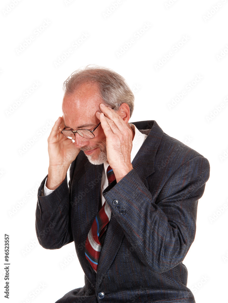Older man in suit with headache. Older man in suit with headache.