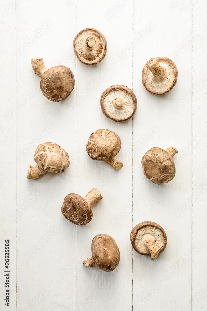 Overhead view of mushrooms on wooden background