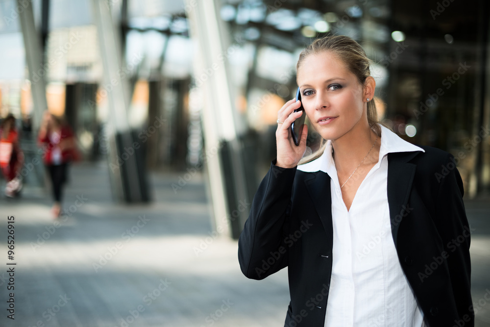 Business woman talking on the phone Business woman talking on the phone