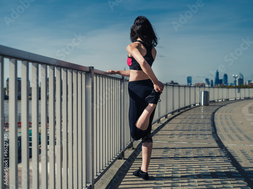 Fit young woman working out in the city