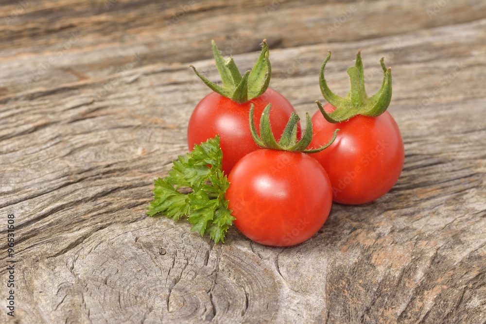 ripe tomatoes on wood background ripe tomatoes on wood background