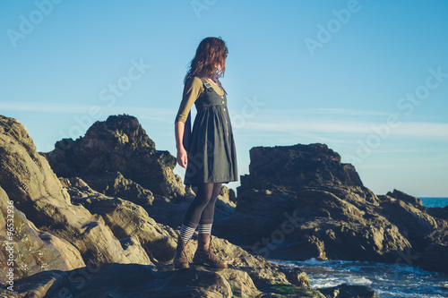 Young owman standing on shore