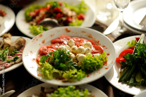 table set service with silverware and glass stemware at restaurant before party