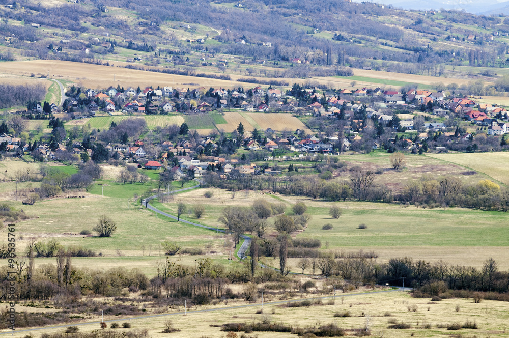 Naklejka premium Sunny landscape of a small village&nbsp;from slightly above