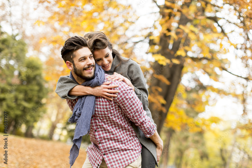 Young couple in the autumn forest Young couple in the autumn forest