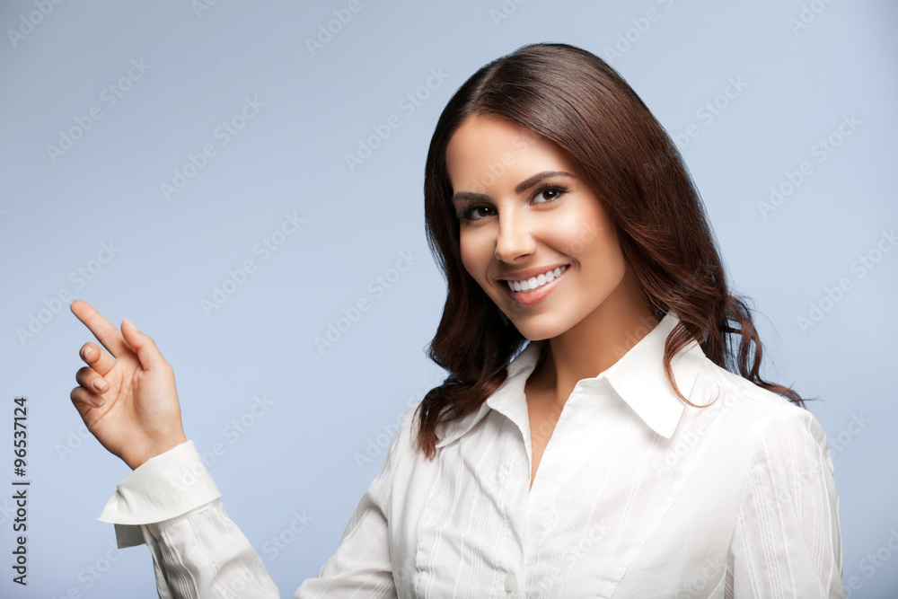 businesswoman, showing something or blank copyspace