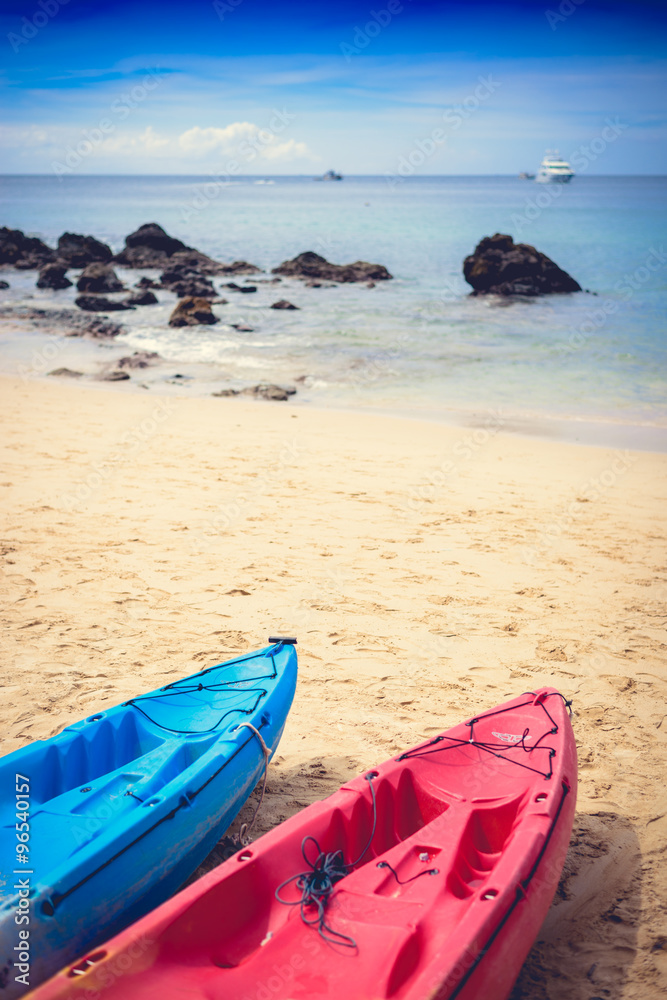 Colorful kayaks on the tropical beach, Yanui Beach Colorful kayaks on the tropical beach, Yanui Beach