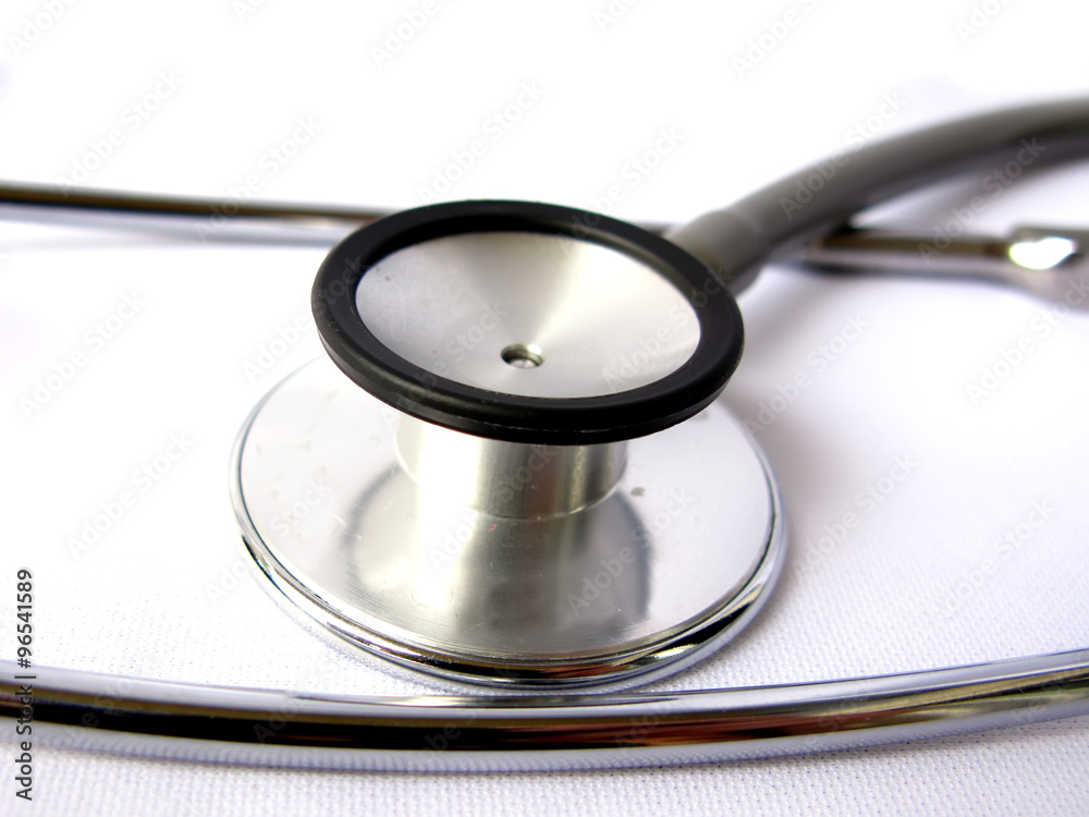A grey medical stethoscope isolated in white background A grey medical stethoscope isolated in white background