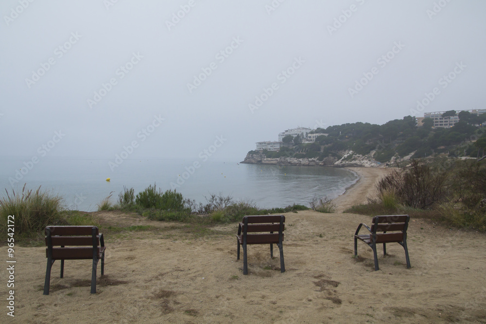 Three empty chairs in the coast Three empty chairs in the coast