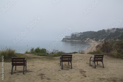 Three empty chairs in the coast