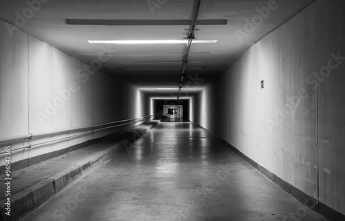 Empty dark tunnel at night. Monochrome