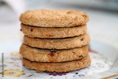 Fresh oatmeal cookies with seeds of cereals and raisins 