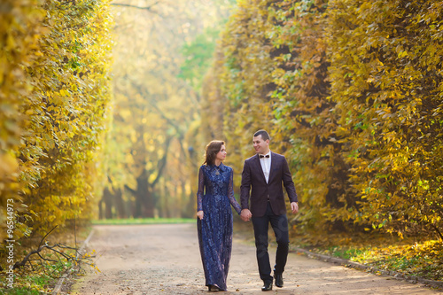 Bride and Groom at wedding Day walking Outdoors in autumn nature © ostap_davydiak