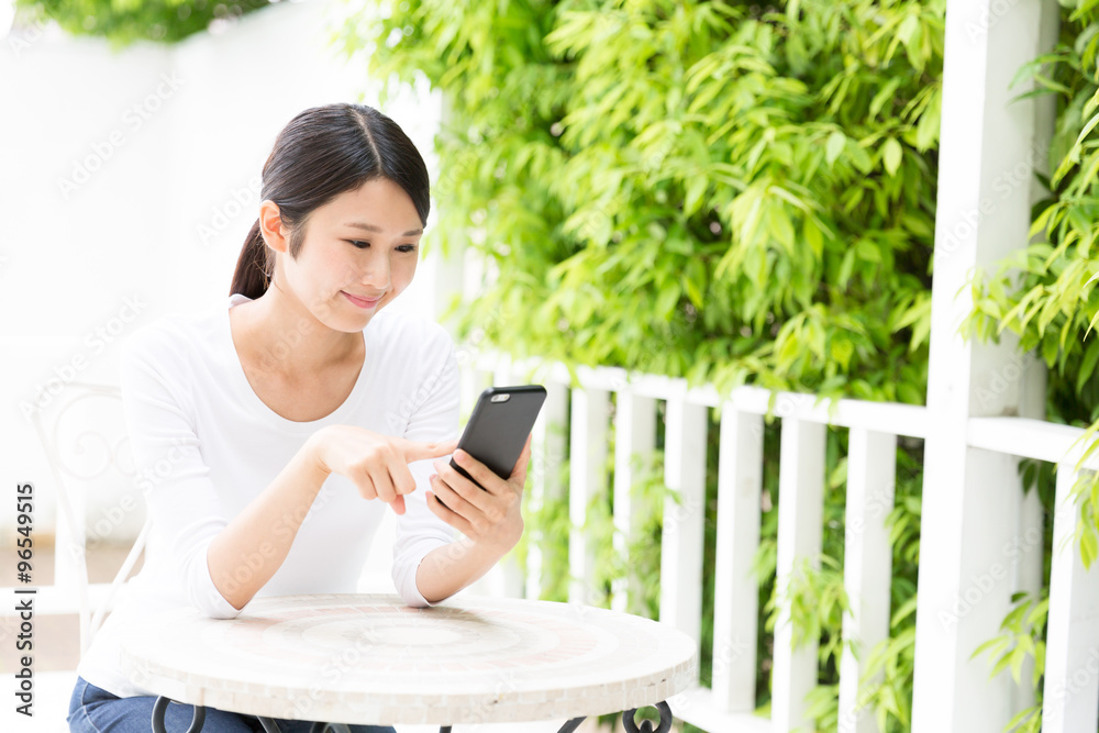 young asian woman using smart phone young asian woman using smart phone