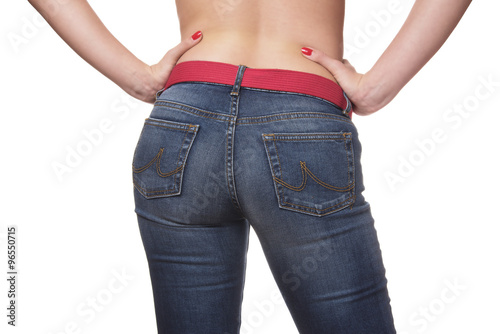 sexy woman holding hands on her waist wearing blue jeans © grufnar