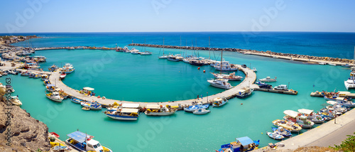 Fishing boats at small port of Vlychada town on Santorini island, Greece