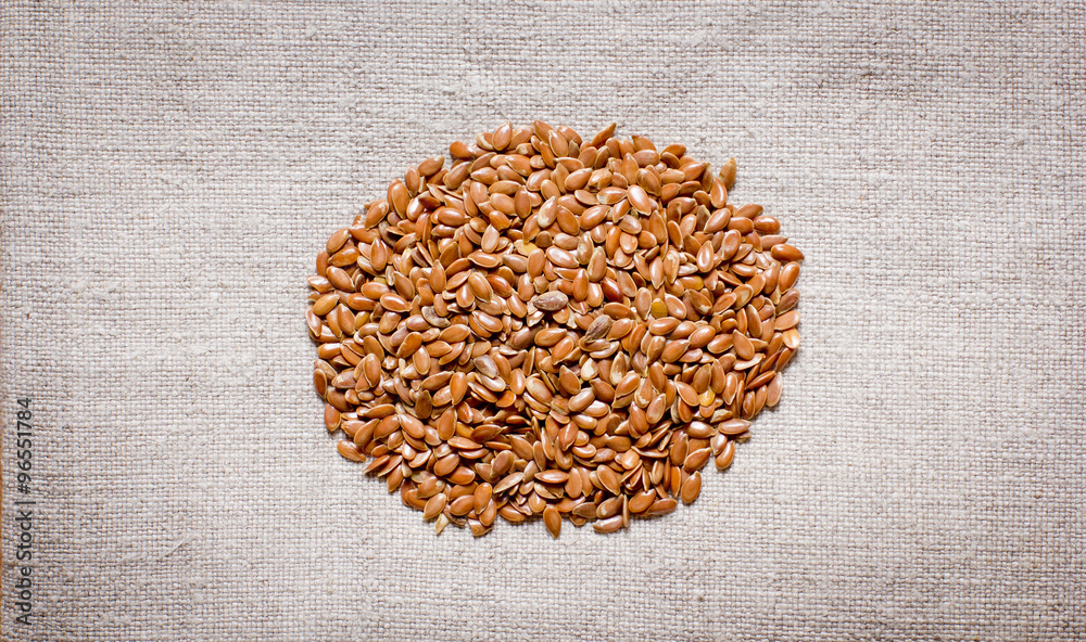 flax seeds on a fabric flax seeds on a fabric