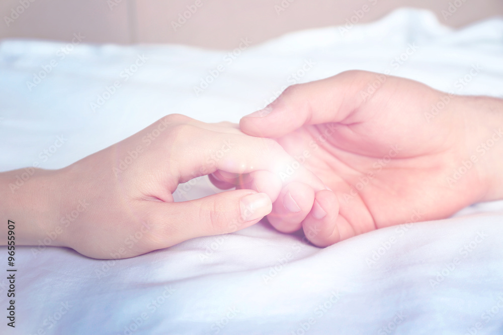 Male and female hands on light background Male and female hands on light background