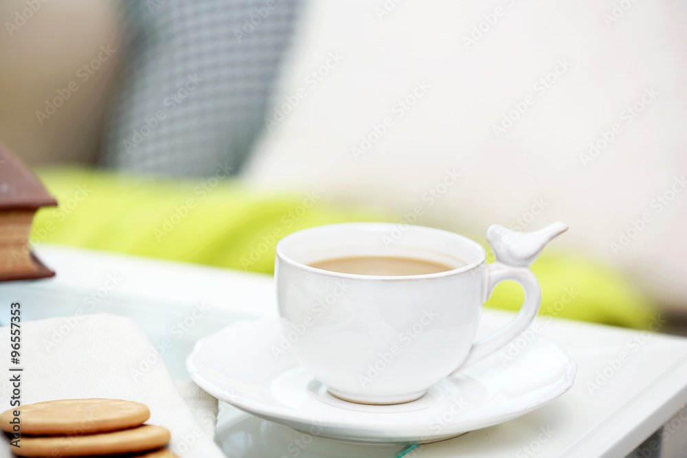 Cup of coffee on table in living room Cup of coffee on table in living room