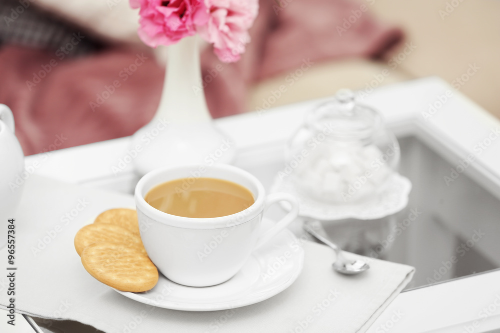 Cup of coffee on table in living room Cup of coffee on table in living room