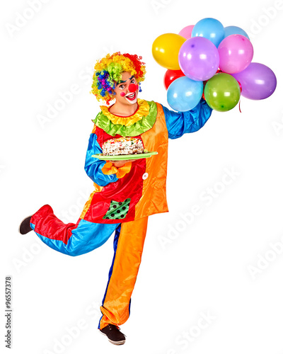Happy birthday clown holding a bunch of balloons. 
