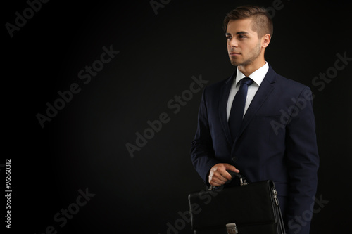 Elegant man in suit with br...