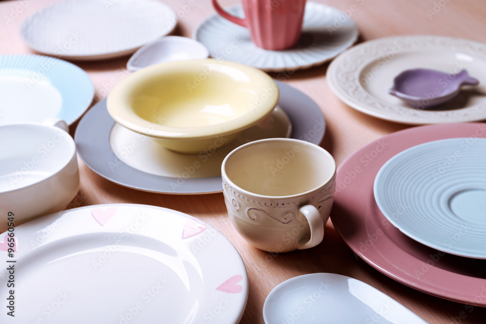 Composition of tableware on rosy background Composition of tableware on rosy background