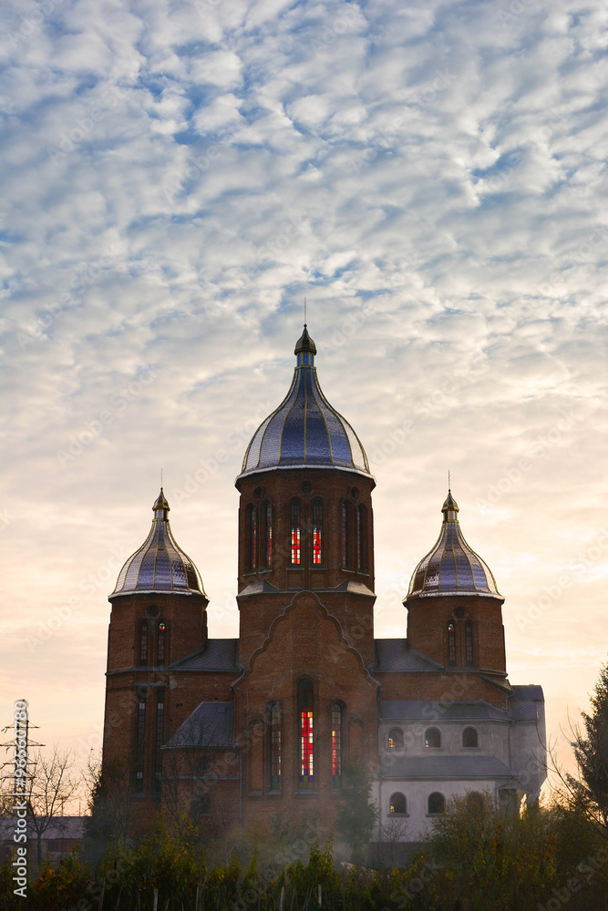 The Holy Trinity Church in Lviv (Ryasne village), Ukraine. Autumn sunset scene 