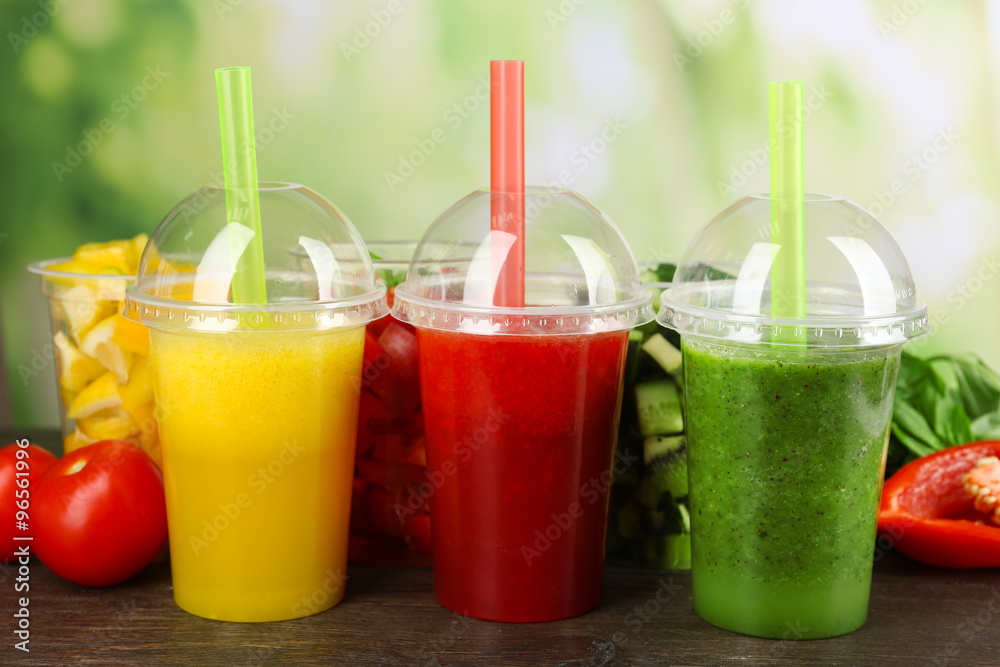 Fresh juice mix fruit, healthy drinks on wooden table, on bright background Fresh juice mix fruit, healthy drinks on wooden table, on bright background