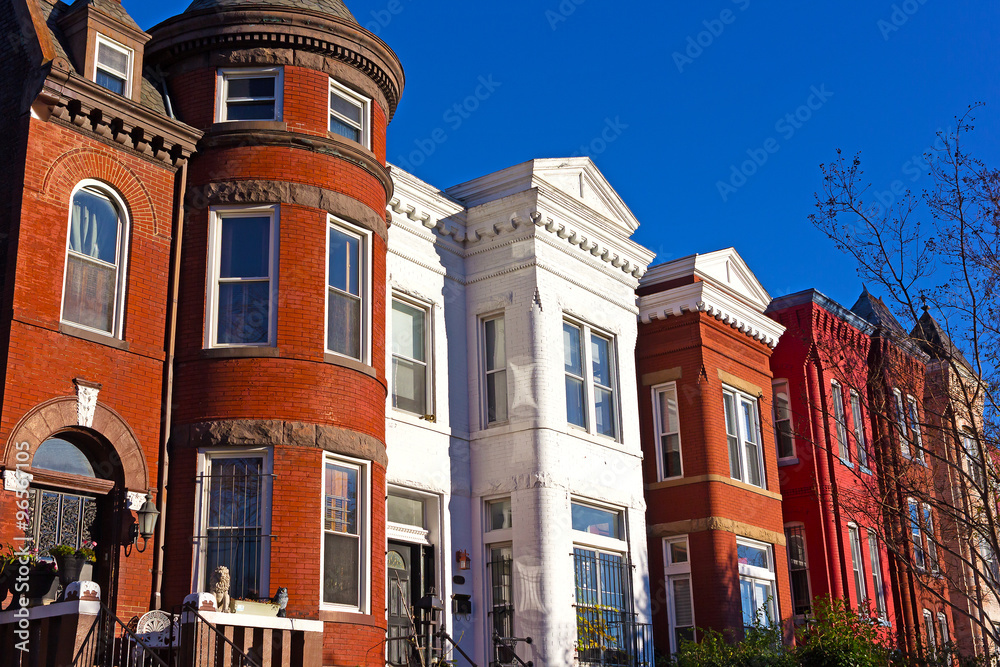 Naklejka premium Historic urban architecture in Mount Vernon suburb of Washington DC. Colorful residential row houses in US capital before sunset in late autumn.