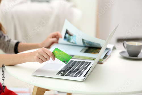 Female making online payment, close up