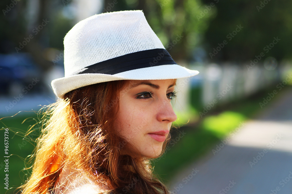 red-haired girl in a hat hipster