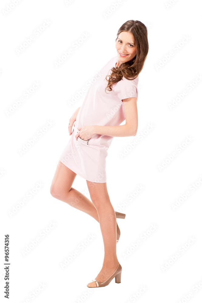 Young slim pretty woman in pink dress posing Young slim pretty woman in pink dress posing