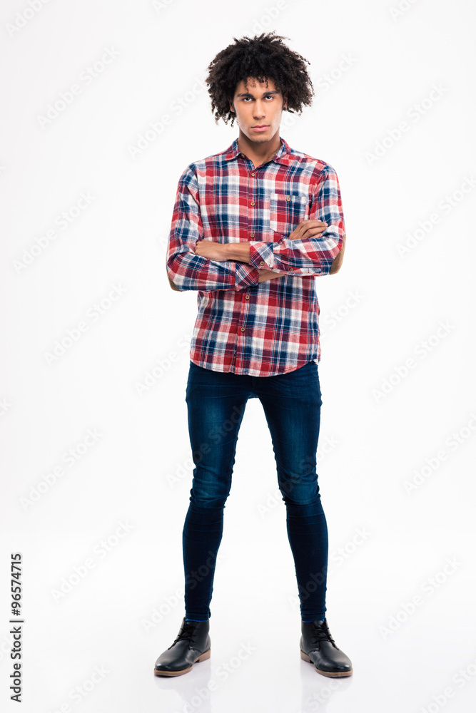 Fototapeta premium Serious afro amerian man standing with arms folded