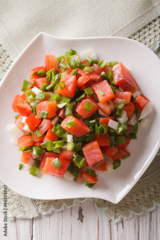 Salted salmon salad with vegetables close-up. vertical top view
Salted salmon salad with vegetables close-up. vertical top view