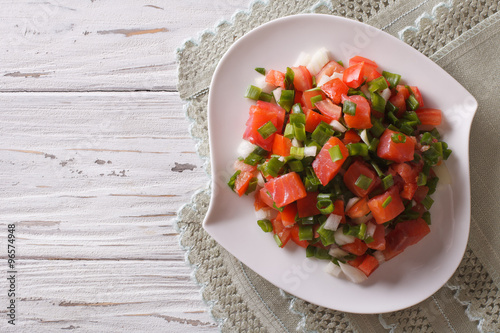 Salted salmon salad with vegetables. Horizontal top view
 photo