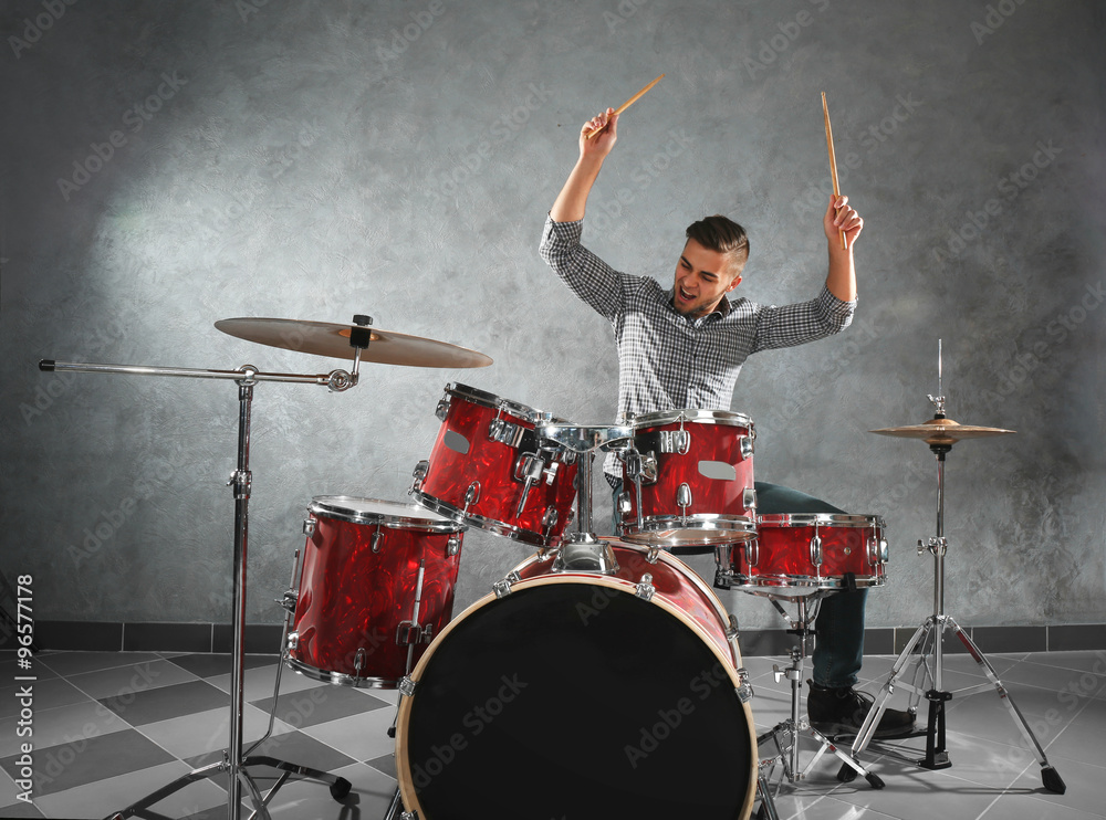 Fototapeta premium Musician playing the drums in a studio