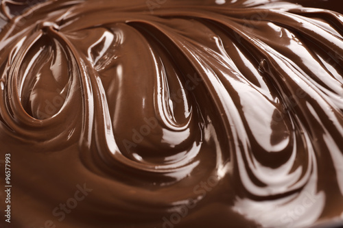 Background of melted milk chocolate, close-up