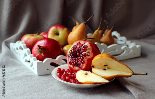 Still life with pomegranates and pears.