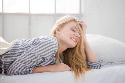 Portrait of sensual tender blonde woman in her bed