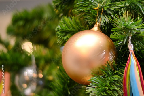 Christmas ball/Close-up of golden ball on christmas tree.